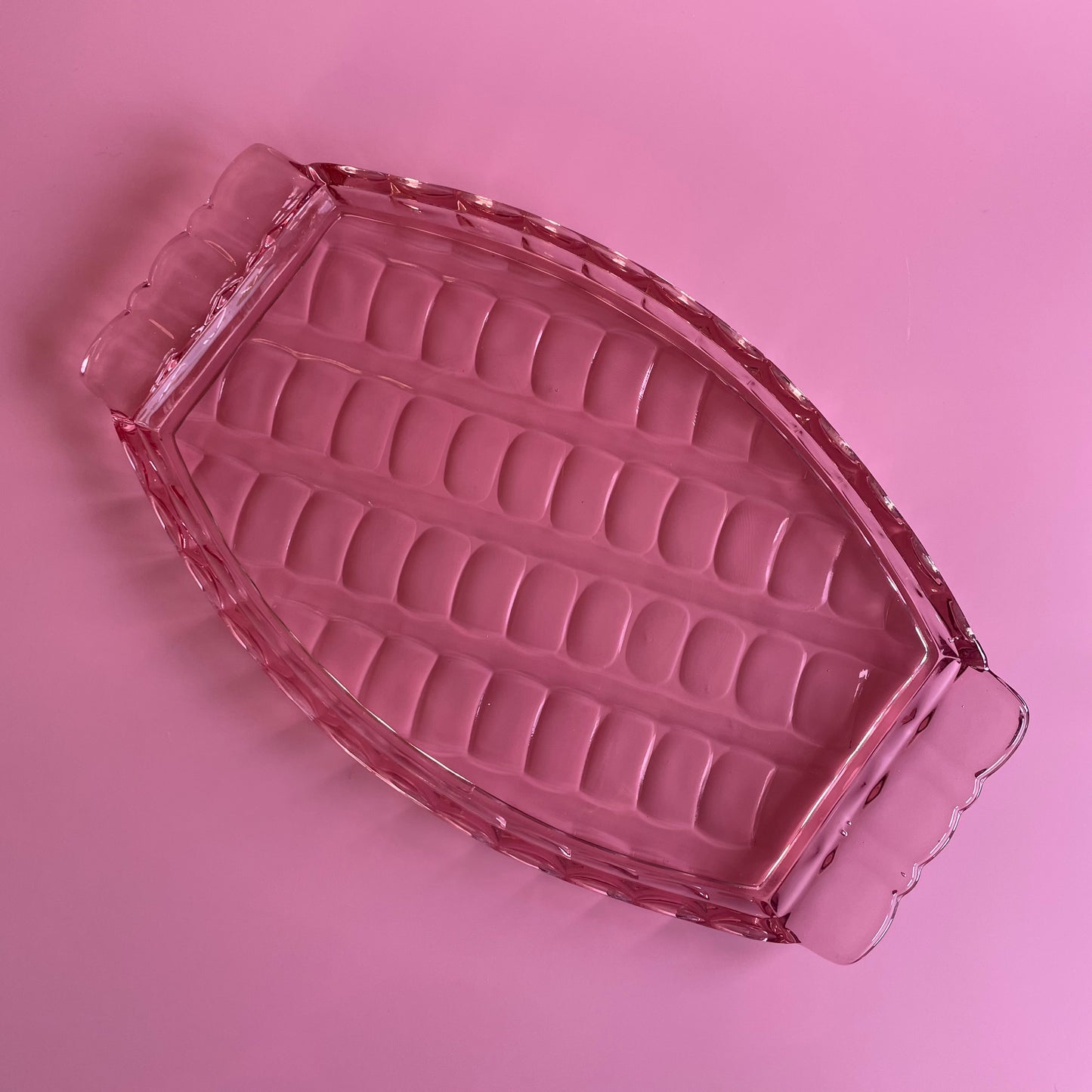 Pink Glass Tray With A Scalloped Pattern