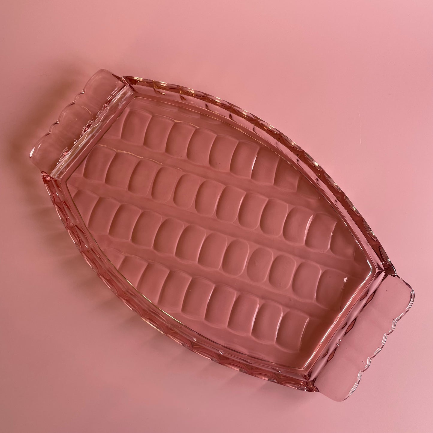 Pink Glass Tray With A Scalloped Pattern