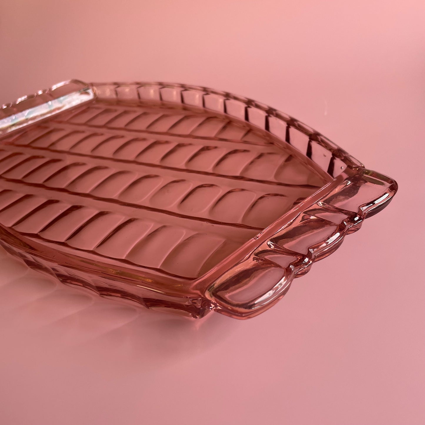 Pink Glass Tray With A Scalloped Pattern